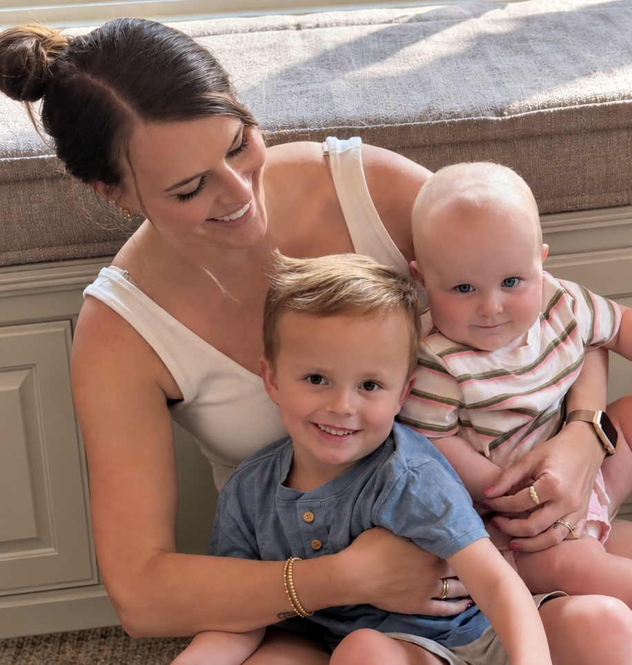 Charlotte on the floor at home with her two children