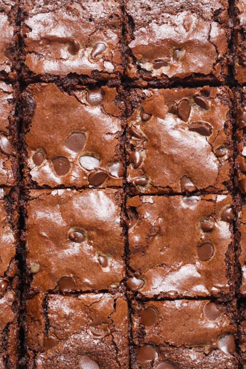Fudgy almond flour brownies topped with chocolate chips in an 8x8 pan