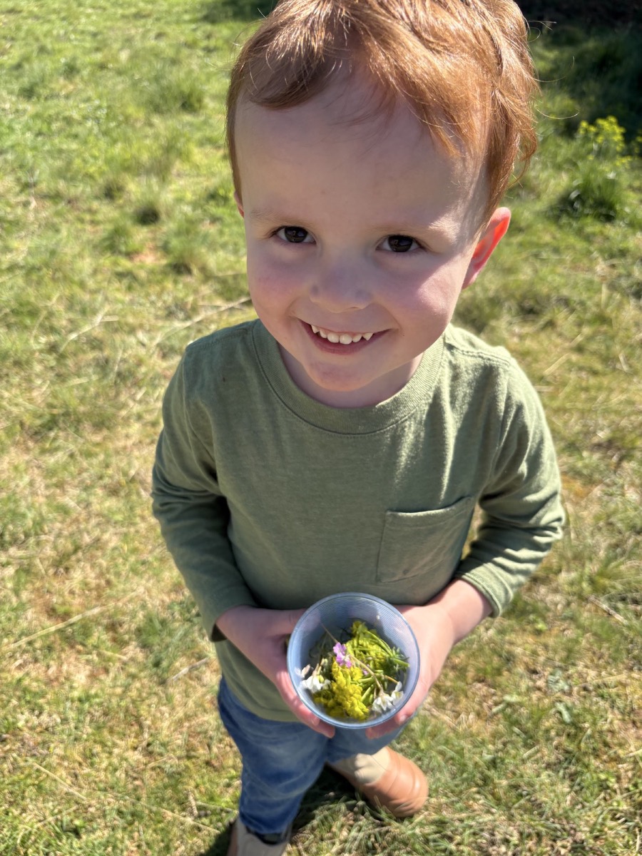 We brought a cup so we could keep the flowers he picked!