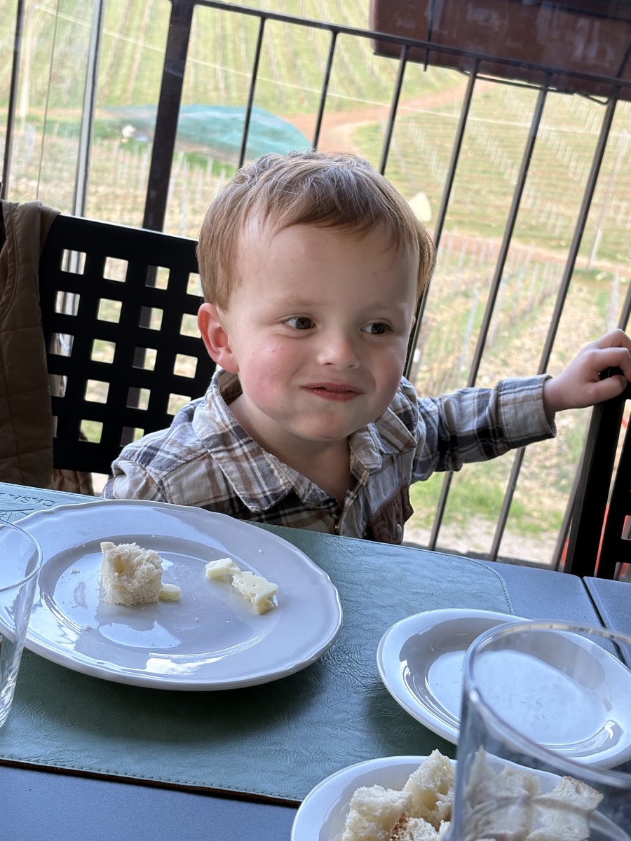 There may or may not be 3 pieces of dark chocolate in his mouth!