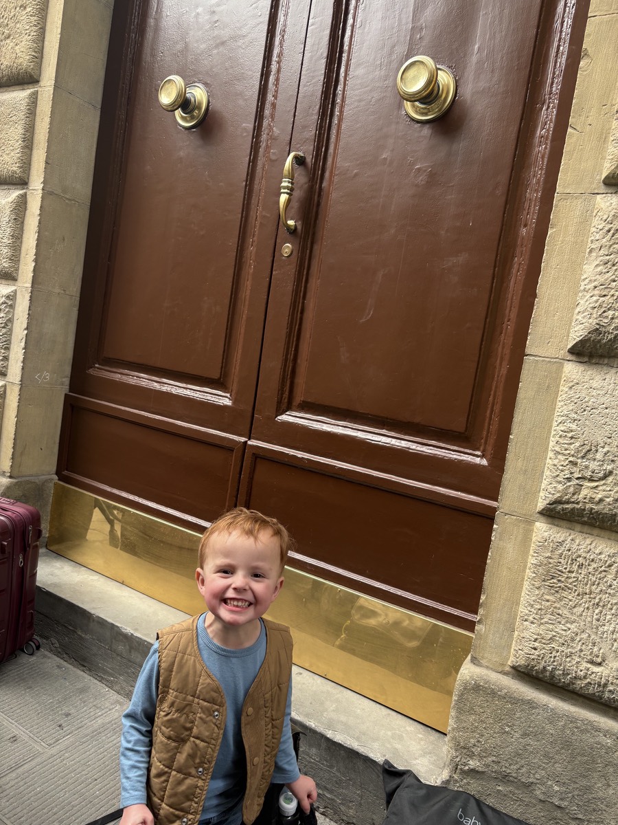 Silas waiting outside our apartment in the heart of the city!