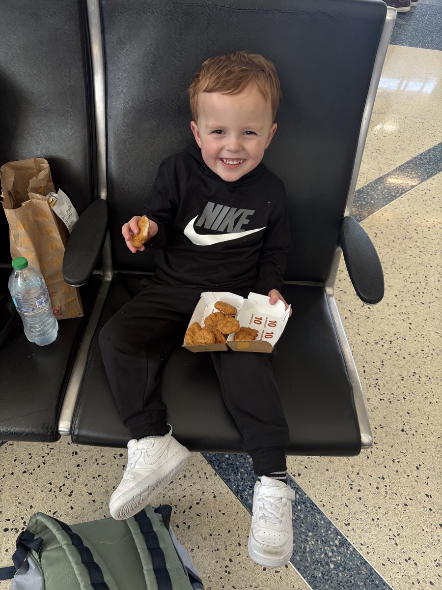 Nuggets and fries since we didn’t think he would eat the plane food…we were right.